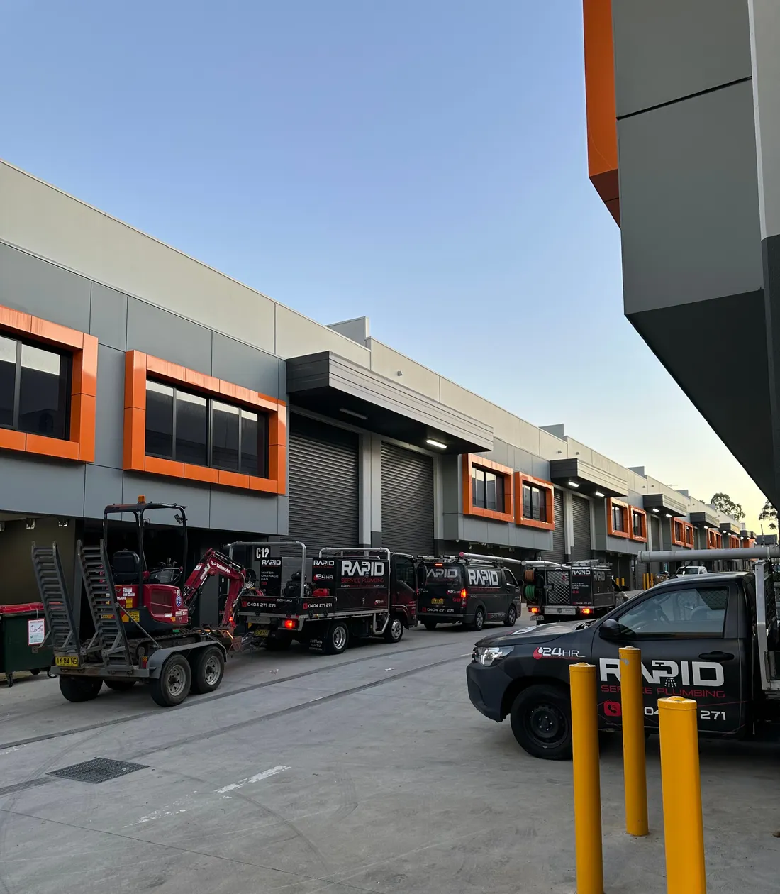 The Rapid Service Plumbing fleet of branded vans and trucks at the depot