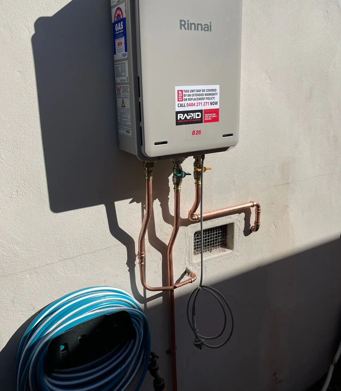 Newly installed Rinnai gas hot water unit with copper pipework