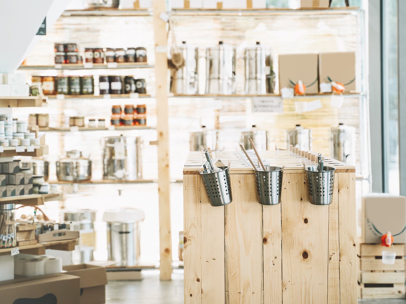 Shop shelves stacked with jars, tins and packaged stock