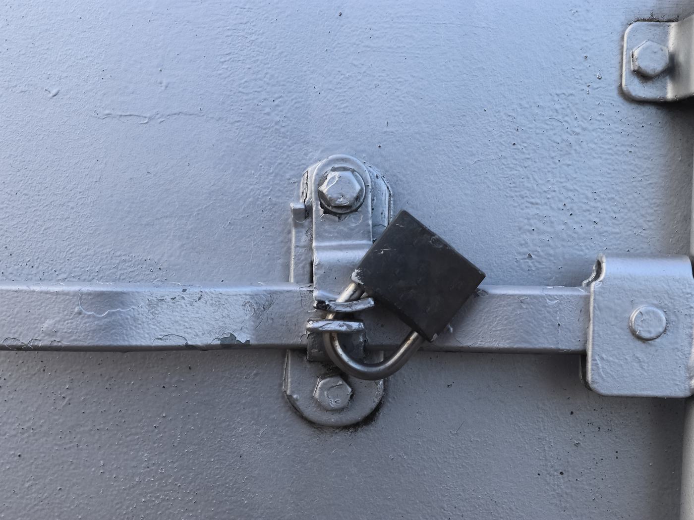 Padlocked site storage box on a construction site