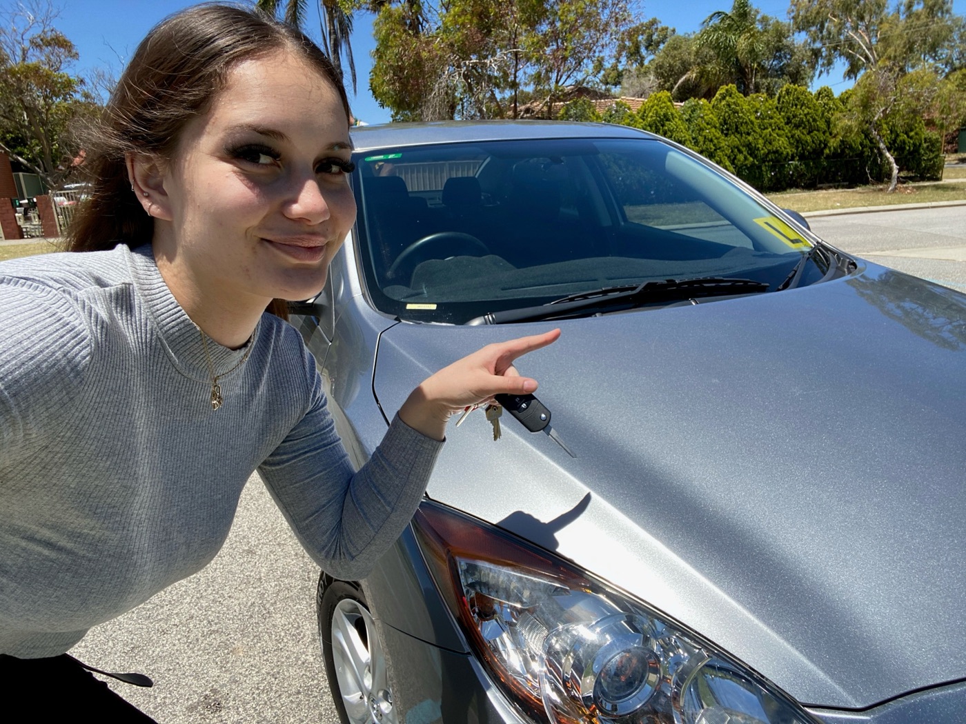 Sophie beside her new Mazda on handover day